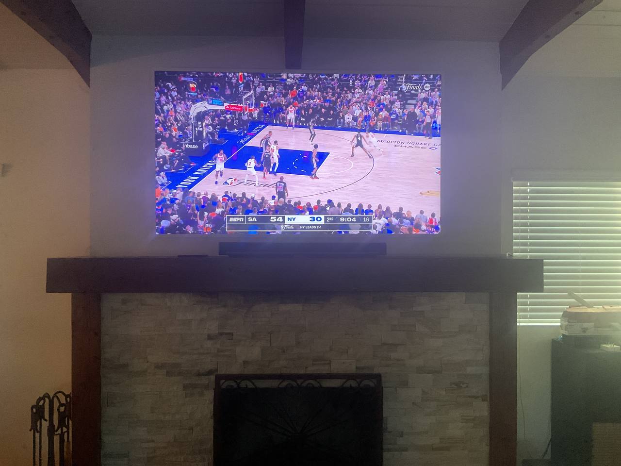 75-inch Samsung Frame TV mounted above a fireplace in Tucson