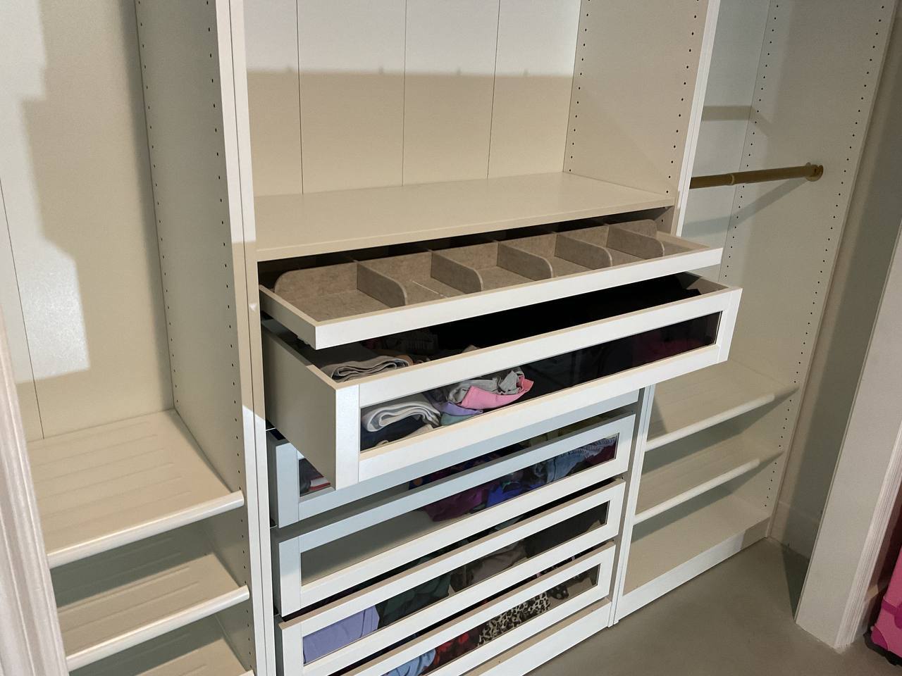Close-up of fitted drawers in a completed closet system