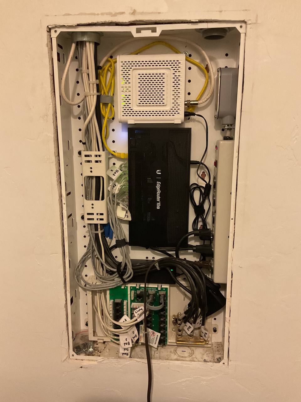 Home network equipment installed in a structured wiring panel in Tucson