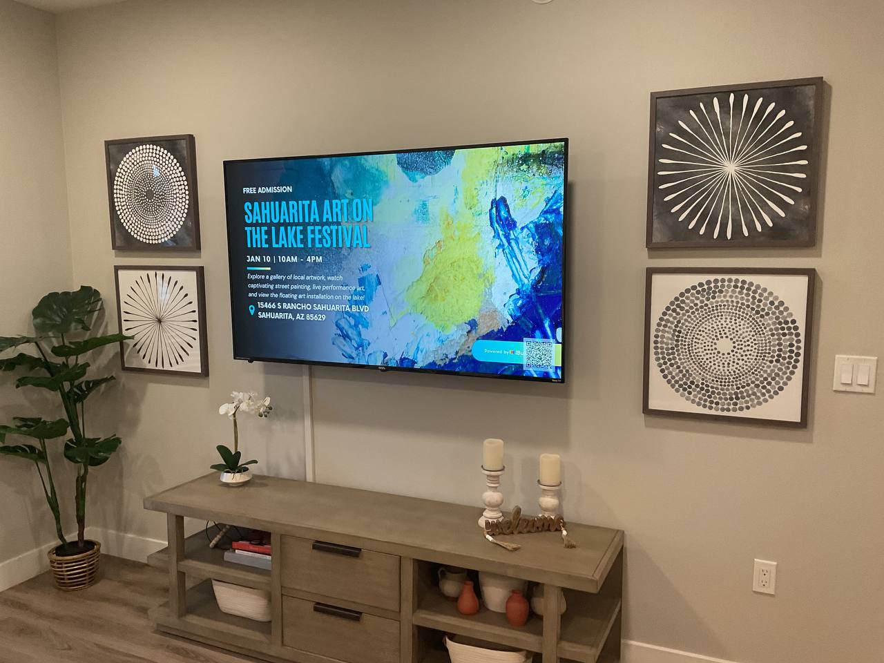 Wall-mounted television installed above a console in Tucson