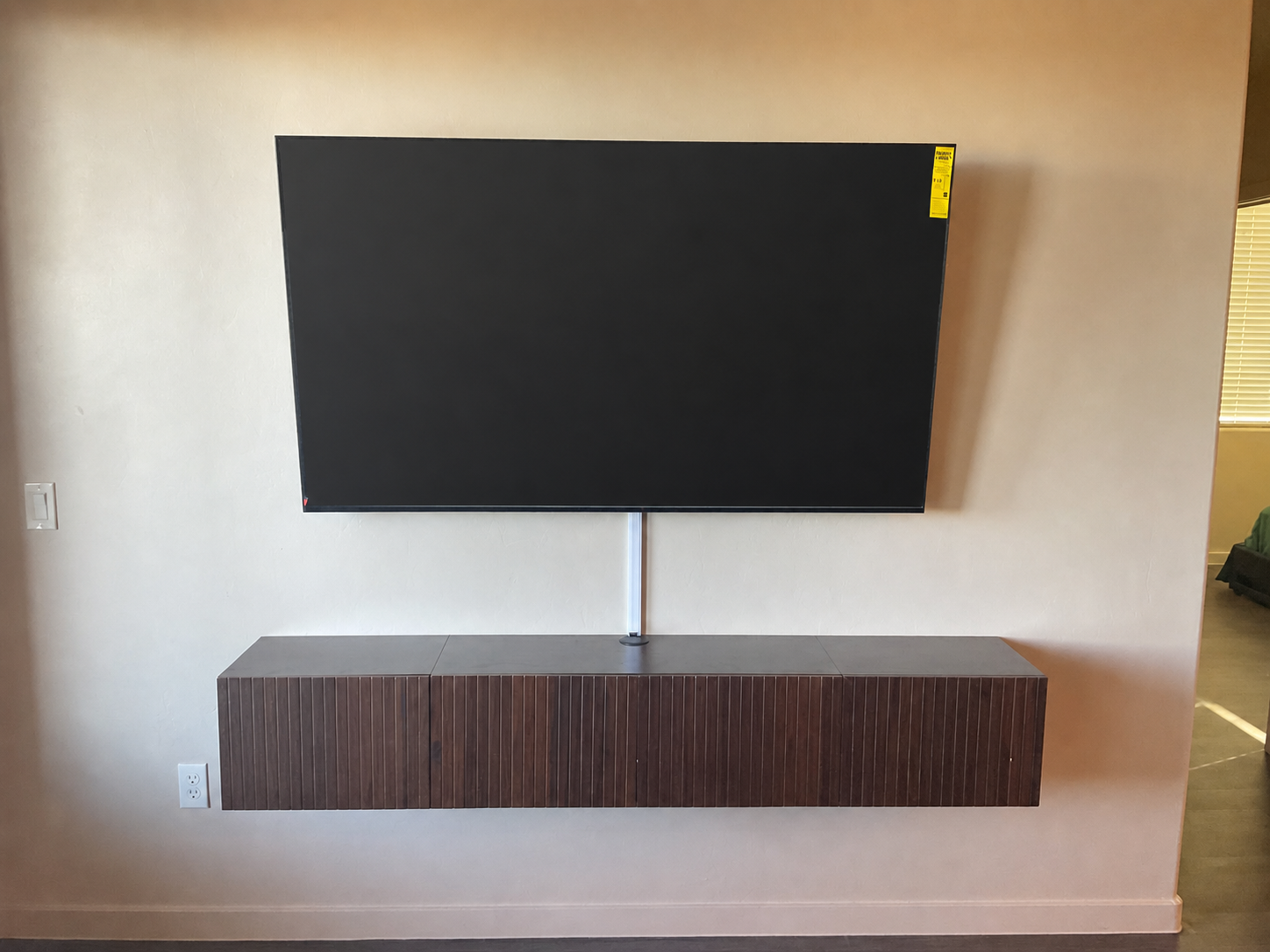 TV mounted over a floating media cabinet in Tucson