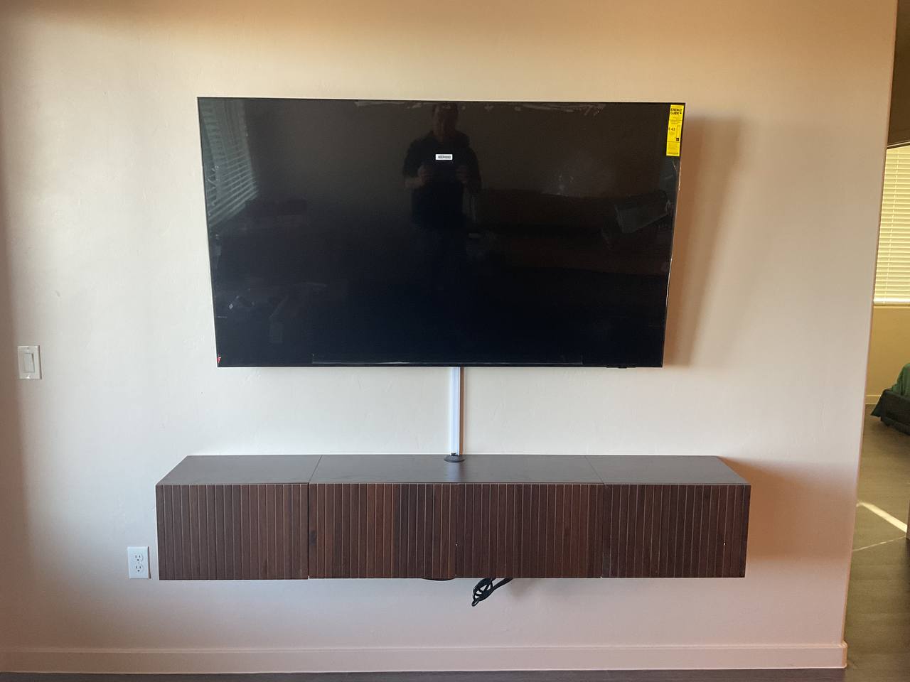 TV mounted over a floating media cabinet in Tucson